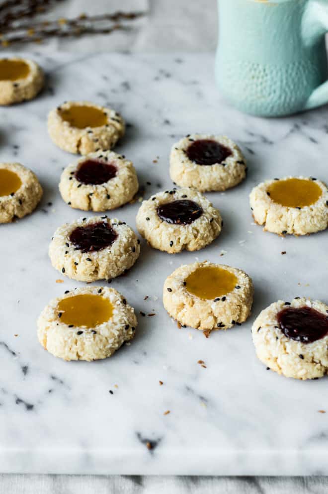 Easy Gluten-Free Coconut Thumbprint Cookies that are made with less than 10 ingredients! by Lisa Lin of webserie.futebolmilionario.com
