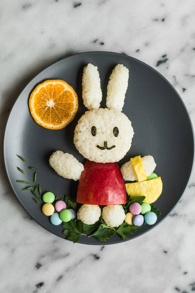 Easy Easter Bunny Food Art - made with rice, an apple, sushi seaweed, parsley, an egg, and M&M's! by @healthynibs