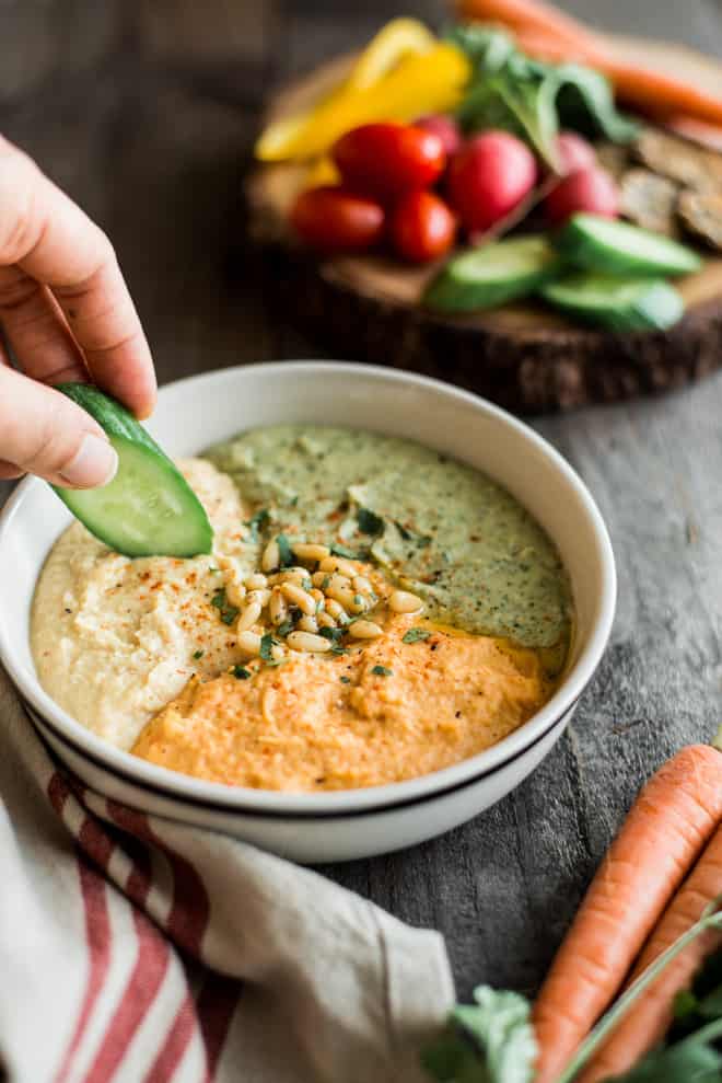 Perfect Hummus Three Ways - Roasted Garlic Hummus, Carrot Harissa Hummus, and Cilantro Jalapeno Hummus - it's a great protein-packed dip for pre- and post-workout! by @healthynibs