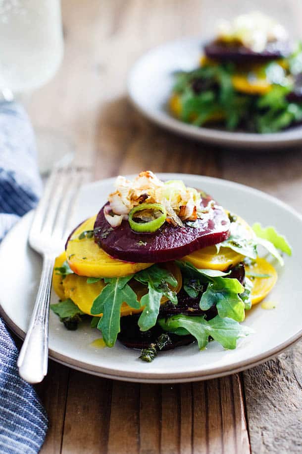 Stacked Beet Salad with Crispy Shallots and Herb-Infused Oil from Heartbeet Kitchen