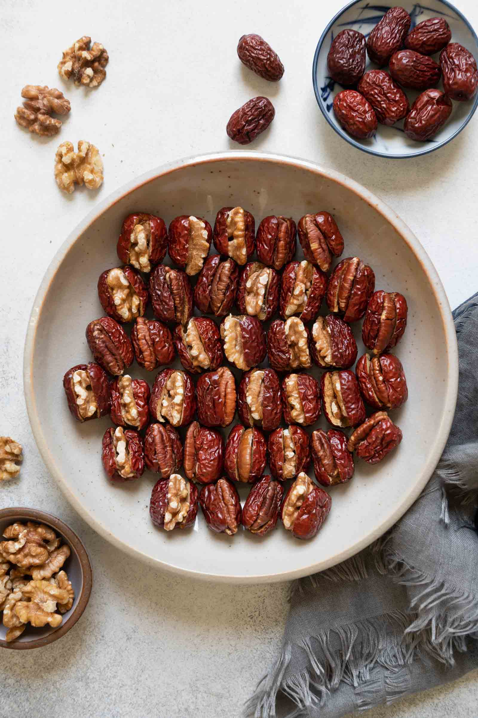 Stuffed Red Dates with Walnuts and Pecans in a plate