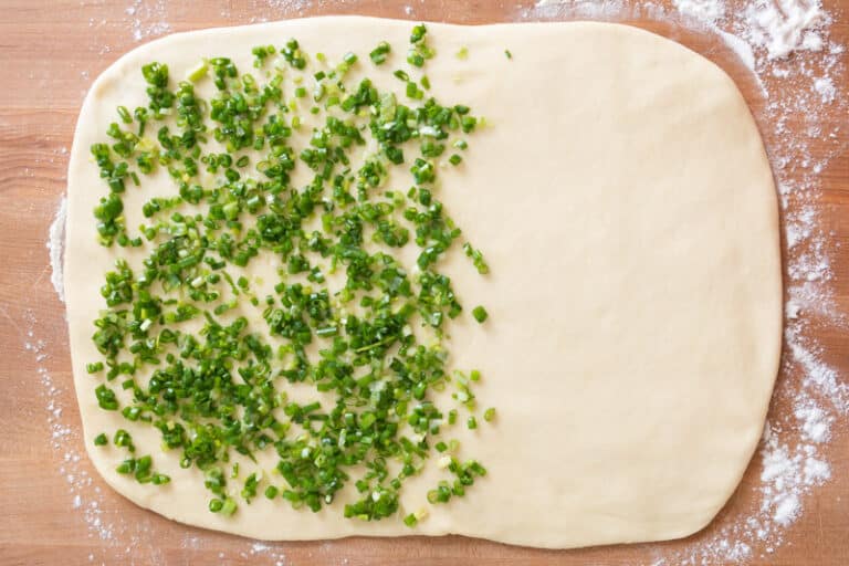 Covering Dough with Scallions